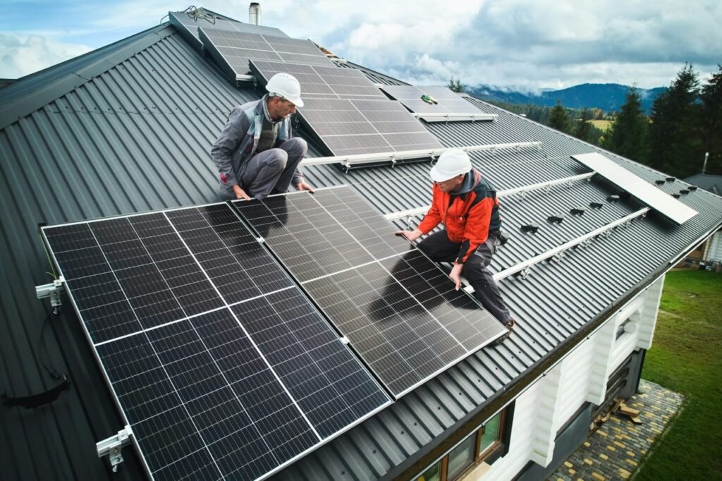 Technicians installing solar panels on a rooftop